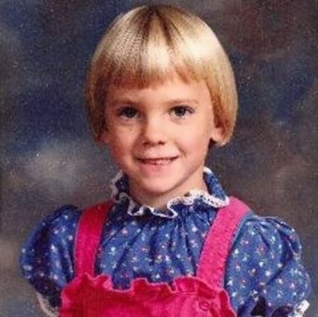 baby anna with a bob cut ruffled shirt with pink suspanders 